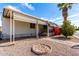 Charming single-story home with covered porch, landscaped yard and palm tree at 11411 N 91St Ave # 48, Peoria, AZ 85345