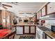 Traditional kitchen featuring a gas range, neutral countertops, and wood cabinetry at 11411 N 91St Ave # 48, Peoria, AZ 85345