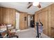 Office with carpet flooring, wood-paneled walls, and a ceiling fan at 11411 N 91St Ave # 48, Peoria, AZ 85345