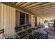 Inviting covered patio offers a relaxing outdoor space with comfortable seating and a view of the peaceful surroundings at 11411 N 91St Ave # 48, Peoria, AZ 85345