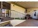 Covered outdoor patio with railing, sliding door, and door to 'Personal Cave' at 11411 N 91St Ave # 48, Peoria, AZ 85345