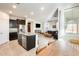 Kitchen island with sink offering a full view of the living room at 1255 N Arizona Ave # 1093, Chandler, AZ 85225