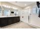 Bright main bathroom featuring a double vanity, a walk-in shower, and tile flooring at 1255 N Arizona Ave # 1093, Chandler, AZ 85225