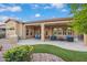 Entertain on this covered back patio, equipped with a built-in grill and furniture in a landscaped area at 12663 W Pinnacle Vista Dr, Peoria, AZ 85383