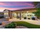 A covered back patio provides an ideal location for outdoor seating and dining, with desert landscaping at 12663 W Pinnacle Vista Dr, Peoria, AZ 85383