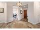 Inviting foyer with a decorative rug, arched entryways, and a warm, ambient light fixture at 12663 W Pinnacle Vista Dr, Peoria, AZ 85383