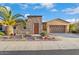 Charming home with stone and stucco, complemented by desert landscaping and a two car garage at 12663 W Pinnacle Vista Dr, Peoria, AZ 85383