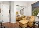 Comfortable living room features hardwood floors and mirrored closet at 12663 W Pinnacle Vista Dr, Peoria, AZ 85383