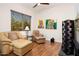 Inviting living room with hardwood floors, comfortable seating, and natural light at 12663 W Pinnacle Vista Dr, Peoria, AZ 85383