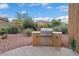 Built-in outdoor grill area, ideal for barbecuing, is surrounded by desert landscaping and an outdoor area at 12663 W Pinnacle Vista Dr, Peoria, AZ 85383