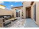 Digitally staged outdoor patio featuring tiled flooring and a sliding glass door at 12663 W Pinnacle Vista Dr, Peoria, AZ 85383