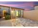 Private outdoor patio area with stone pavers and a sliding glass door leading indoors at 12663 W Pinnacle Vista Dr, Peoria, AZ 85383