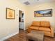 Cozy sitting room featuring a comfortable sofa and a view into the bathroom at 12663 W Pinnacle Vista Dr, Peoria, AZ 85383