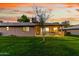 The beautiful home features well-maintained lawn and a charming covered patio, perfect for outdoor enjoyment at 12703 W Shadow Hills Dr, Sun City West, AZ 85375