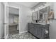 Bathroom features a double sink vanity, stylish tile, and modern fixtures at 12703 W Shadow Hills Dr, Sun City West, AZ 85375