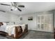 Relaxing bedroom featuring a TV and closet with white shutters at 12703 W Shadow Hills Dr, Sun City West, AZ 85375