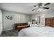 Primary bedroom features a ceiling fan and a shuttered window for adjustable lighting at 12703 W Shadow Hills Dr, Sun City West, AZ 85375