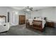 Spacious bedroom with neutral carpet and a ceiling fan at 12703 W Shadow Hills Dr, Sun City West, AZ 85375