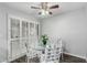 Bright breakfast nook with glass table, seating for four, and shuttered windows at 12703 W Shadow Hills Dr, Sun City West, AZ 85375