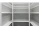 Walk-in closet features custom shelving for ample storage at 12703 W Shadow Hills Dr, Sun City West, AZ 85375