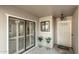 Welcoming entrance with sliding glass door and decorative plants and flowers at 12703 W Shadow Hills Dr, Sun City West, AZ 85375