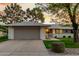 Charming single-story home featuring a spacious two-car garage and well-maintained landscaping with mature trees at 12703 W Shadow Hills Dr, Sun City West, AZ 85375