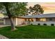 Charming single-story home featuring a spacious two-car garage and well-maintained landscaping with mature trees at 12703 W Shadow Hills Dr, Sun City West, AZ 85375