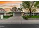 Charming single-story home featuring a spacious two-car garage and well-maintained landscaping with mature trees at 12703 W Shadow Hills Dr, Sun City West, AZ 85375