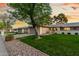 Charming single-story home featuring a spacious two-car garage and well-maintained landscaping with mature trees at 12703 W Shadow Hills Dr, Sun City West, AZ 85375