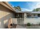 Front porch with outdoor seating and a brick privacy wall at 12703 W Shadow Hills Dr, Sun City West, AZ 85375