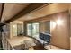 Covered patio featuring seating and view through the sliding glass doors at 12703 W Shadow Hills Dr, Sun City West, AZ 85375