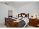 Bedroom with cozy bed, wooden nightstands, and shuttered window at 15642 W Arbor Trl, Surprise, AZ 85374