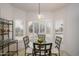 Sunny breakfast nook featuring a glass table, comfortable seating, and bright natural light at 15642 W Arbor Trl, Surprise, AZ 85374