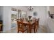 Elegant dining room with a wooden table, seating for six, and sliding glass doors to the patio at 15642 W Arbor Trl, Surprise, AZ 85374