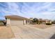 Charming home with a two-car garage, drought-resistant landscaping, and a well-maintained yard at 15642 W Arbor Trl, Surprise, AZ 85374