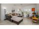 Bright living room with plush seating, tile floors, and a large window with stylish shutters at 15642 W Arbor Trl, Surprise, AZ 85374