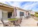 Outdoor patio with seating and table, overhead covering, beautiful landscaping, perfect for relaxing and entertaining at 15642 W Arbor Trl, Surprise, AZ 85374
