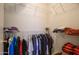 Walk-in closet with ample shelving and hanging storage at 15642 W Arbor Trl, Surprise, AZ 85374