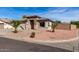 Single-story home featuring desert landscaping, a two-car garage, and a cozy, welcoming entrance at 16035 N 159Th Dr, Surprise, AZ 85374