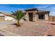 Charming single-story home featuring a desert landscape, tile roof, and cozy, welcoming entrance at 16035 N 159Th Dr, Surprise, AZ 85374