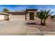 Inviting single-story home featuring a desert landscape and a two-car garage at 16035 N 159Th Dr, Surprise, AZ 85374