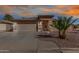 Charming home featuring a well-manicured front yard and a two-car garage, offering curb appeal and convenience at 16035 N 159Th Dr, Surprise, AZ 85374