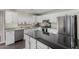 Stylish kitchen featuring granite countertops, stainless steel appliances, and white cabinetry at 16035 N 159Th Dr, Surprise, AZ 85374