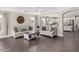Open-concept living room with tile floors, neutral paint, and an archway to the adjoining kitchen at 16035 N 159Th Dr, Surprise, AZ 85374
