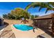Backyard features a sparkling pool and lush landscaping, creating a private and tranquil retreat at 16035 N 159Th Dr, Surprise, AZ 85374