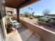 Balcony with chairs offering a relaxing view of the landscaped yard at 16657 E Gunsight Dr # 182, Fountain Hills, AZ 85268