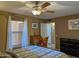 Bedroom with an ornate wooden desk under the window and a fan on the ceiling at 16657 E Gunsight Dr # 182, Fountain Hills, AZ 85268