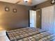 Bedroom with plaid comforter and decorations hanging on the wall at 16657 E Gunsight Dr # 182, Fountain Hills, AZ 85268