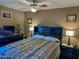 Comfortable bedroom with soft lighting and a television in the corner at 16657 E Gunsight Dr # 182, Fountain Hills, AZ 85268