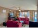 A cozy living room with a ceiling fan, a flatscreen TV and views of the outdoors at 16657 E Gunsight Dr # 182, Fountain Hills, AZ 85268